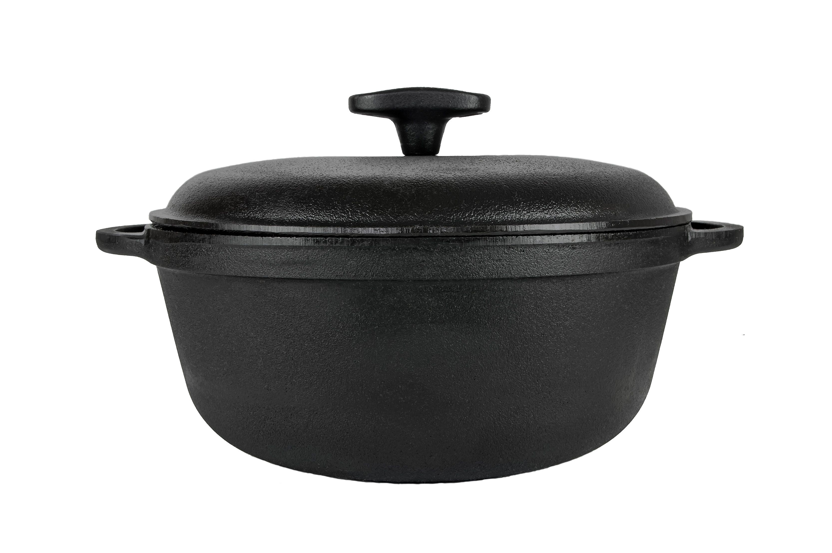 鋳鉄の鍋、ふたが付いている鋳鉄の鍋、黒い。側から。