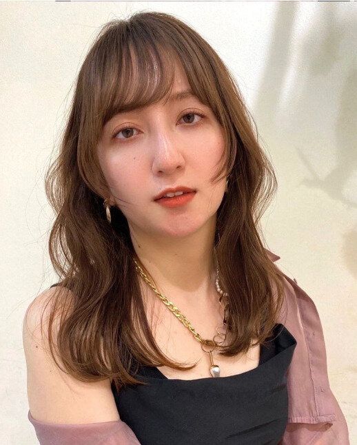 リュクスなカールがポイント!フワッとセミロング