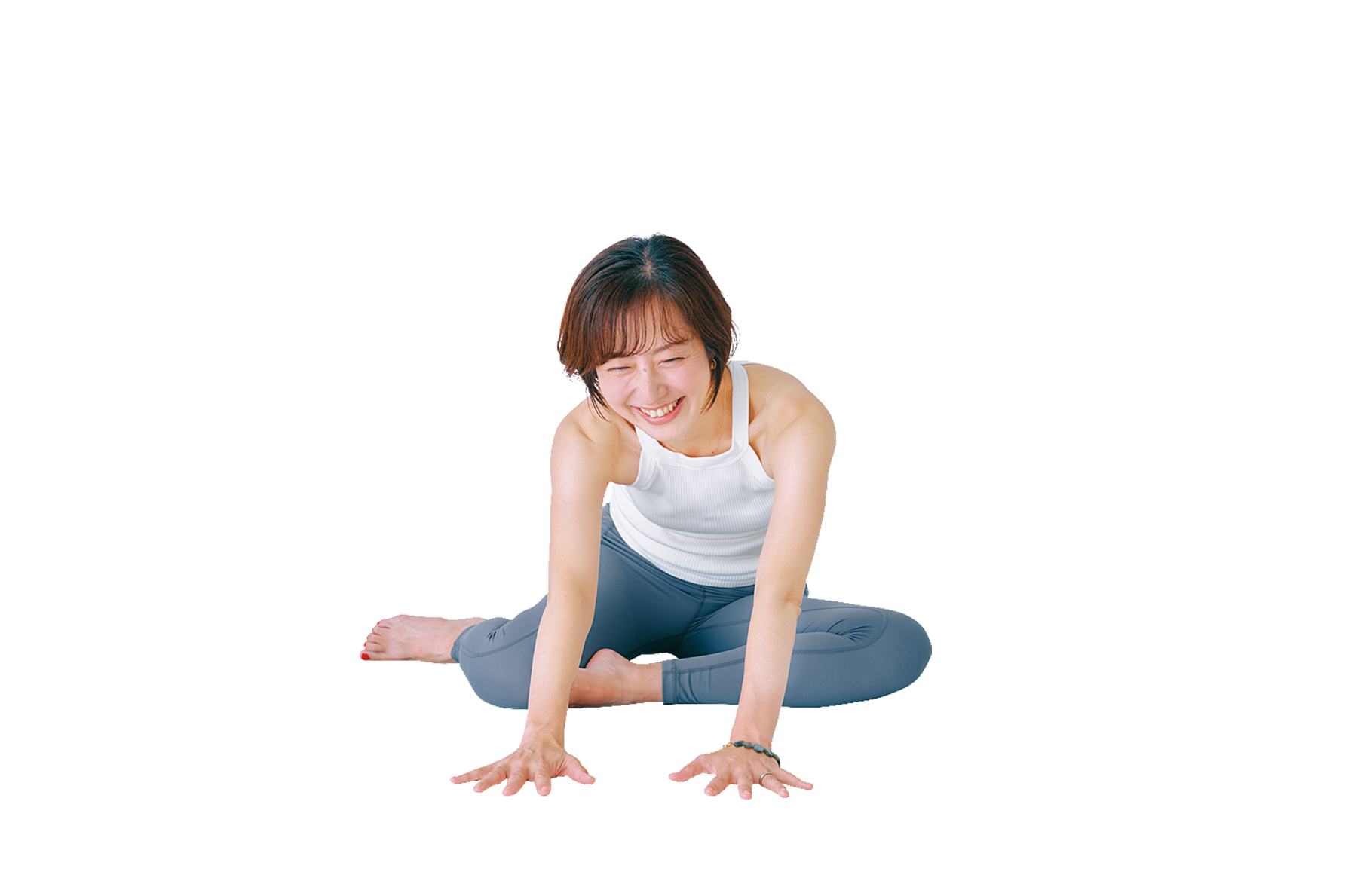 片足を反対足のひざにつけて、手を前に伸ばしている様子